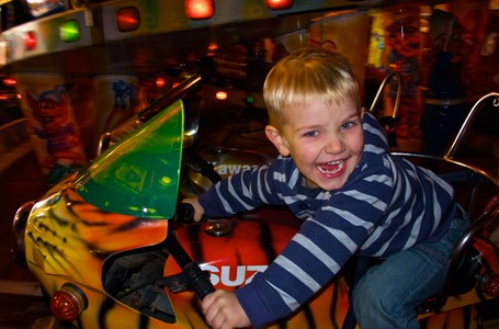 Child On Funfair Motorbike