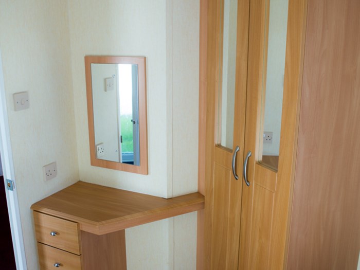 Main bedroom vanity and wardrobe caravanlet.co.uk